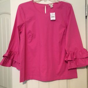 Pink top with ruffle detail at wrists